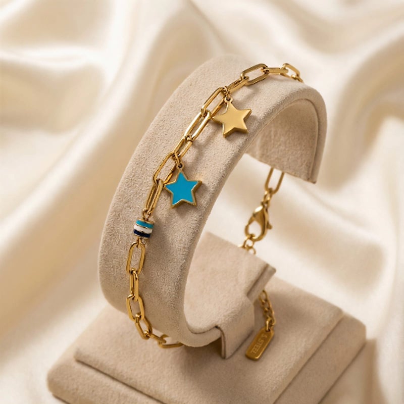 A stylish gold bracelet, crafted from rust-resistant stainless steel, featuring a modern chain design and star-shaped charms (gold and blue). A touch of elegance for your wrist with an adjustable clasp for a perfect fit. - Image 4